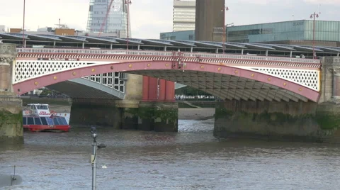 Boat floating under the Blackfriars Bridge in London Stock Footage 60998241
