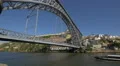Boat floating under Dom Luis bridge in Porto 4k or 4k+ Resolution