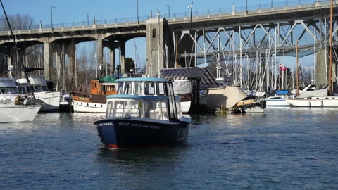 Boat floating on the water with city view, Aquabus on Granville island Stock Footage