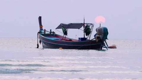 Boat floating in the water during sunset Stock-Footage 146764940