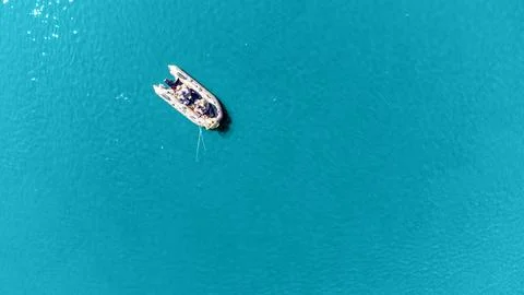 A boat is floating on the water Stock Photos
