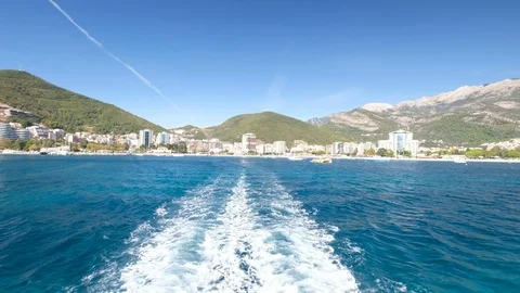 Boat is Floating on the Waves and Leaves a Trail in the Red Sea 動画素材 95927290