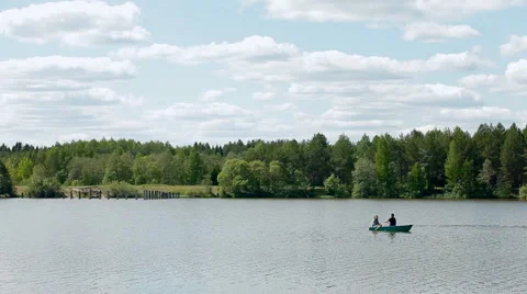 A boat is floating on a wide river Stock Footage 64541991