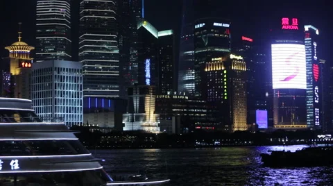 Boat floats on the river against the backdrop of the city at nigh Stock Footage 45162515