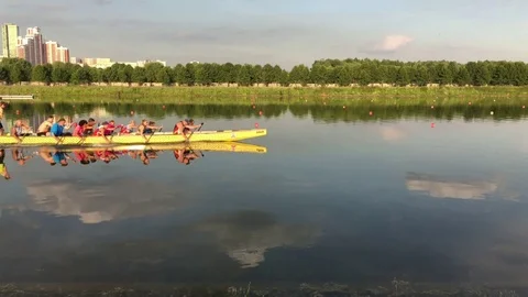 Boat floats with rowers Stock Footage 77569176