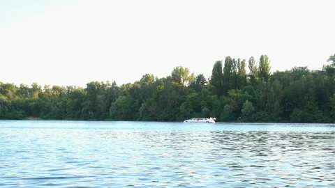 The boat in the form of a car floats down the river in 4K. Stock Footage 135411083