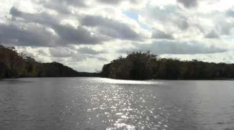 Boat Front Cloudy water lake trees 1 Stock Footage 10922445