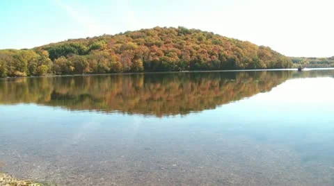 Boat on Glassy Lake in Fall 스톡 동영상 12571520