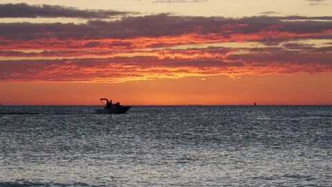 Boat gliding across sunset. Stock Footage 143806262