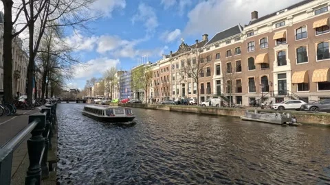 Boat go through the canals of Amsterdam Stock Footage 240105642