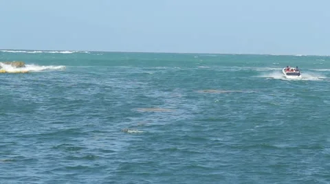 Boat going to sea through breakers waves Stock Footage 12154894