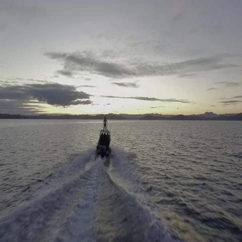 Boat going into the sunset Stock Footage 69302663