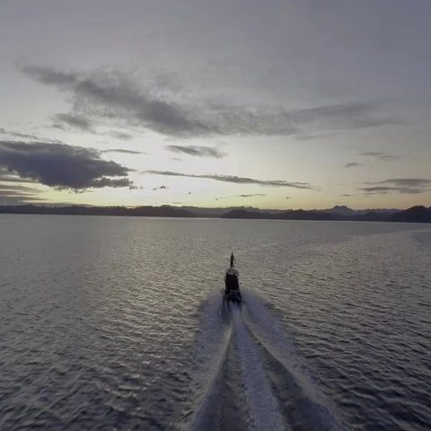 Boat going into the sunset Stock Footage 69303363