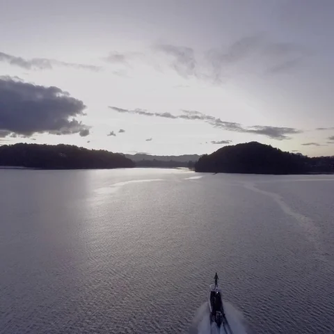 Boat going into the sunset Stock Footage 69304076