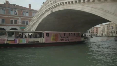 Boat Going Through Bridge in Venice, Italy Stock Footage 148628370
