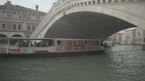 Boat Going Through Bridge in Venice, Italy Stock Footage 148697276