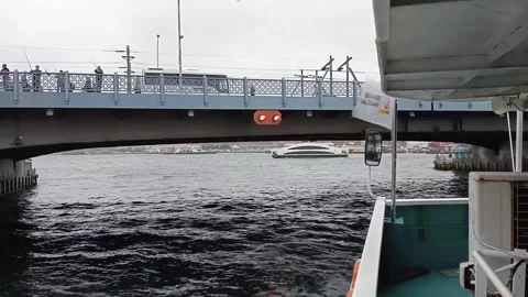 Boat going under a bridge on the River Bosporus Stock Footage 329119239