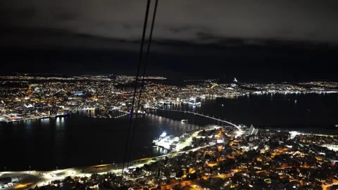 Boat going under Tromso bridge view at night from Fjellheisen cable car Stock Footage 301467858