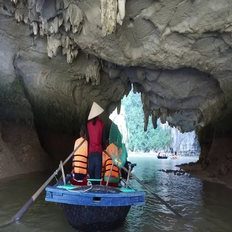 Boat Going Underneath Cliff Hang Stock Footage 69396705
