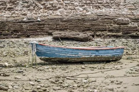 Boat on ground during tide Stock Photos