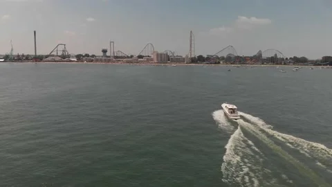 Boat heading towards Cedar Point Amusement Park on Lake Erie in Sandusky Ohio Stock Footage 142245232