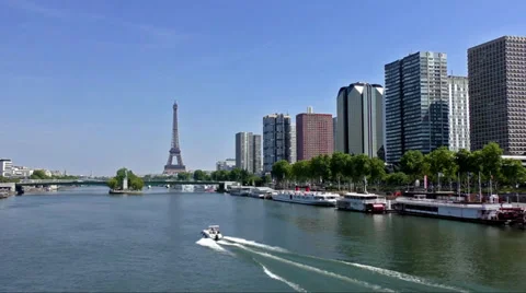 Boat heading towards the Eiffel Tower and the Statue of Liberty Stock Footage 37747224