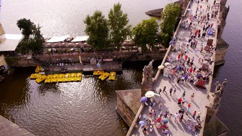 Boat Hire below crowded Charles Bridge in Prague Stock Footage 82705655