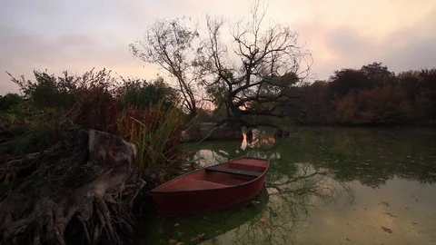 Boat on the lake on a cloudy dawn Stock Footage 72308900