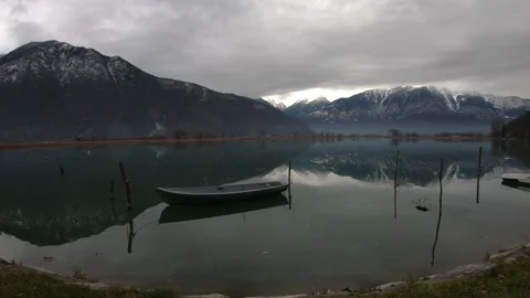 Boat on the lake, reflection of the mountains 動画素材 147316188