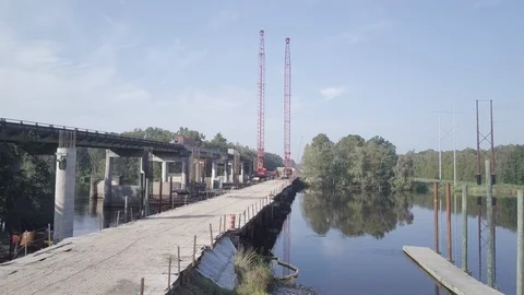 Boat launch during construction of bridge - 4K Drone Video stock 110924664