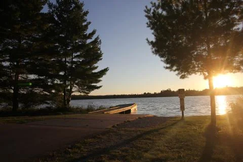 A boat launch at sunset Stock Photos