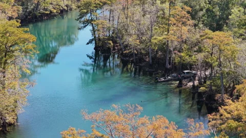 Boat Launching into Turquoise Spring at Morrison Springs Stock Footage 331315344