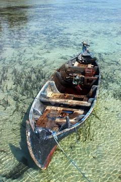 Boat leaning on the edge Stock Photos