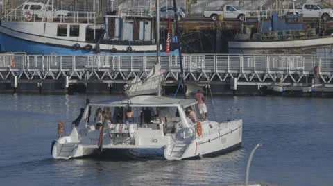Boat leaving harbor Stock Footage 22995123