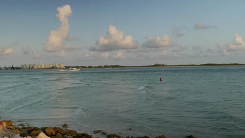 Boat left to right Sunset at Pass-a-grille Beach in St Petersburg Florida. Low l Stock Footage 276676465