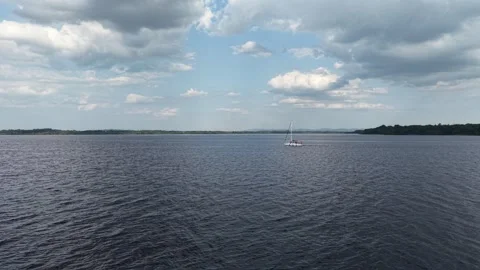 Boat on Lough Derg Under Dramatic Cloudy Sky, Ireland Video stock 339743450