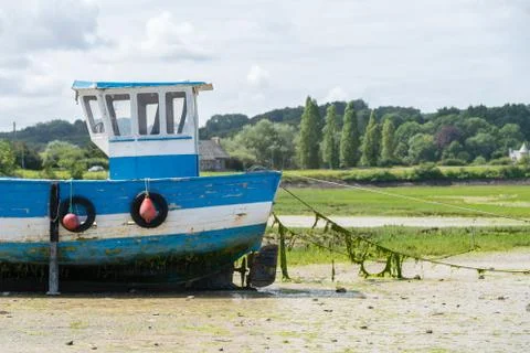 Boat at low tide Stock Photos