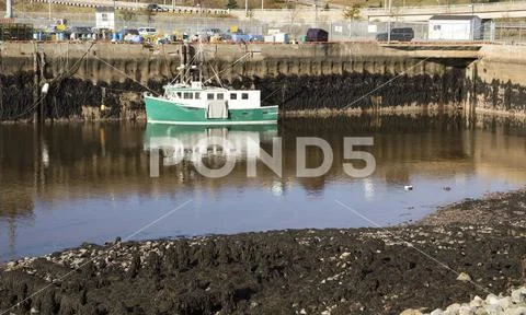 Boat at low tide in Saint John, New Brunswick, Canada Stock Photos