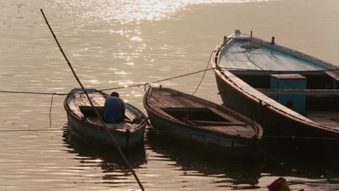 Boat man sits on the boat Stock Footage 132966838