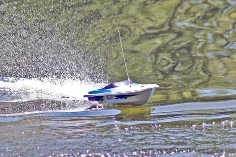 Boat model in motion on the water Stock Photos
