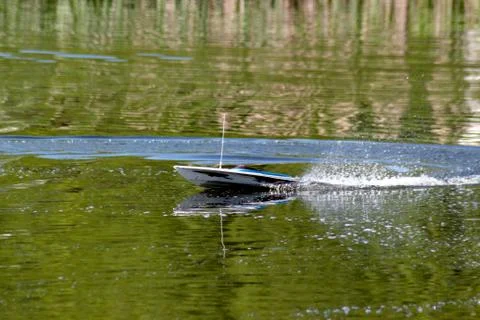 Boat model in motion on the water Stock Photos