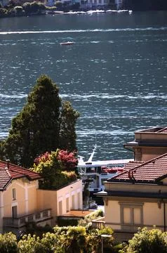 A boat at the Moltrasio pier. Stock Photos