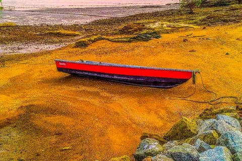 A boat is moored on the beach Fotos de archivo