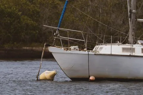 Boat moored up in the river Stock Photos