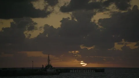 Boat moored in the sea at sunset Stock Footage 97637022
