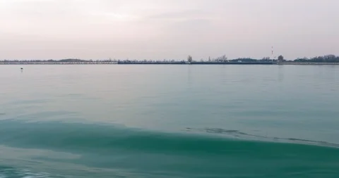 Boat motion overlooking the shoreline. Cruise ship wake waves the sea. 4k 2160p Stock Footage 119861953