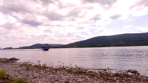 The boat moves along the river in cloudy weather Stock Footage 244047266