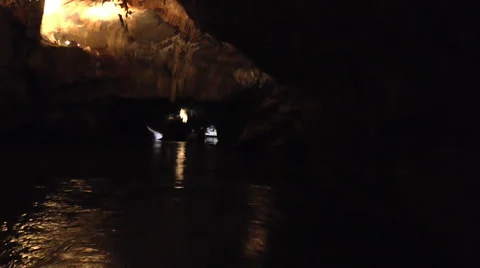 A Boat Moves Deeper into a Cave Video stock 51897055