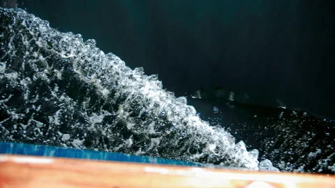Boat moving over the surface of a flat sea. Stock Footage 133035224