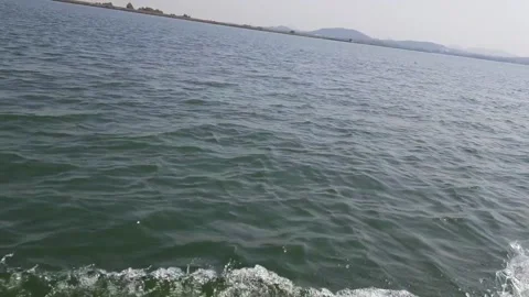 Boat Moving Through Water Creating Waves and Splashes – Close-Up Water Motion Stock Footage 332903184